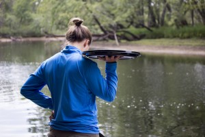 Osgood Pond Semester student Hanna Cromie awaits the first wave of paddlers with snacks at hand.