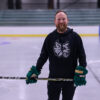 A man with a hockey stick