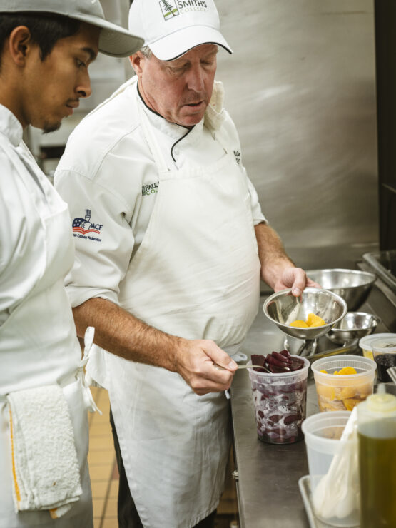 Two people in a kitchen