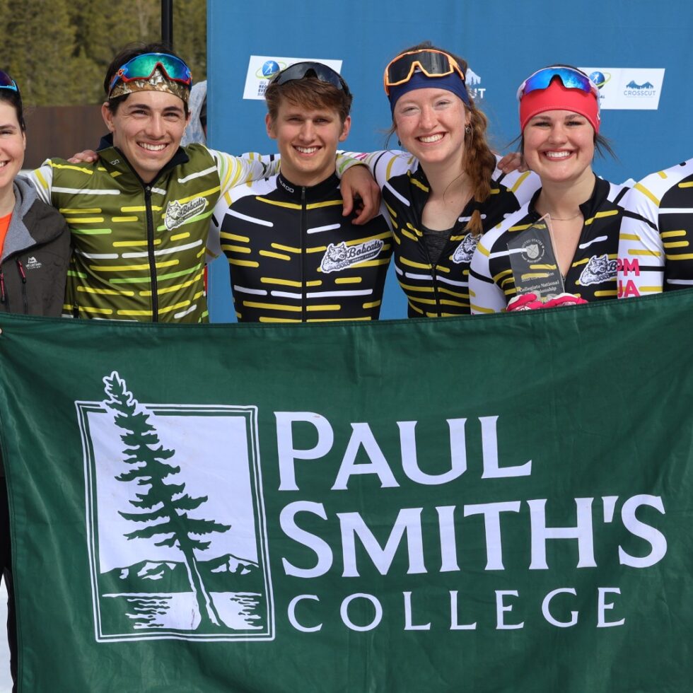 Group of students holding a PSC banner