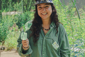 A woman holding milkweek
