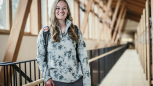 A woman standing in a library