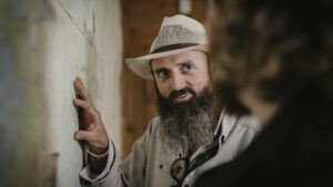 A man talking and pointing to a map