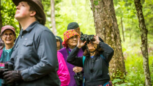 A group of people with binoculars