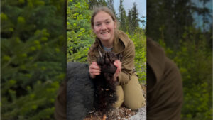 A woman holding a bear