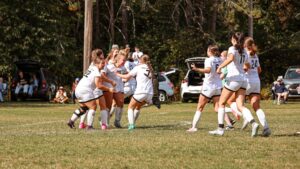 A group of soccer players celebrating