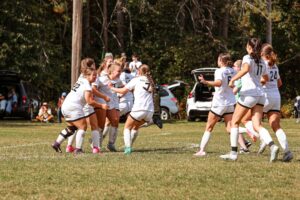 A group of soccer players celebrating