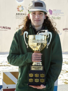 A man holding a trophy