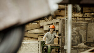 A person using a sawmill